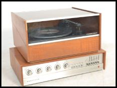A retro 1960's Ferguson teak wood record player and amp, the record player with inset Garrard deck