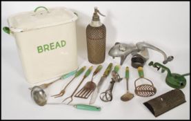 A collection of vintage 20th Century kitchenalia items to include an enamel bread bin and lid with