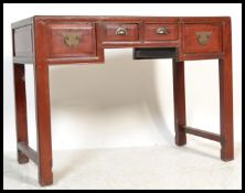 A 20th Century Chinese red lacquered elm alter / side table, four drawers to the front with fitted
