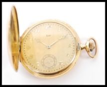 A hunter cased pocket watch by Lip stamped 'K18' and with control marks, the dial with black gilt