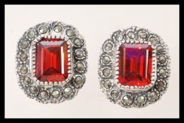 A pair of silver Renaissance style earrings with central faceted square rubilite's with marcasite