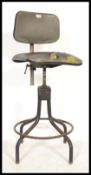 An early 20th century Industrial machinists - factory chair stool having  vinyl seat and back rest