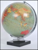 A vintage retro 20th century Phillips 1960's desk top globe raised on a stepped square base.Dated