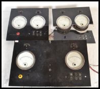 A group of three vintage Industrial 20th Century industrial volt meter reading dials, each board