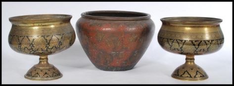 A selection of early 20th century Indian enamelled brass wares to include a pair of bulbous form