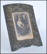 A 19th century Chinese silver plated on copper large picture frame having an easel back with