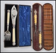 A 19th century Victorian cased carving set having ivory twist handles with silver plated mounts