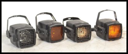 A group of four vintage retro 20th century industrial spotlights having adjustable mounts. German