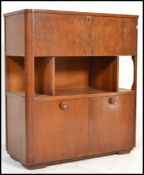 A 1930's Art Deco walnut recordl / drinks cabinet by Broadway ' Record Magazine  ' Cabinet. The