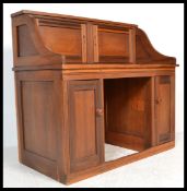 An unusual 19th century Victorian mahogany writing desk converted from a roll top desk having a