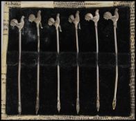 A cased set of six silver hallmarked picks / cocktail sticks having cockerel finial tops. Complete