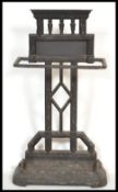 A 19th century Victorian Coalbrookdale style cast iron stick stand of architectural form having