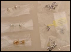 A selection of stud earrings to include a pair of stamped 925 silver vermeil earrings prong set with