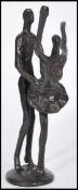 A 20th century bronze figurine group depicting a ballerina and partner mid dance raised on