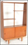 A vintage / retro 20th Century teak wood room divider bookcase / upright cabinet. Raised on shaped