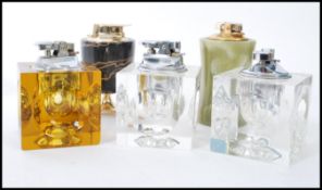A group of vintage retro 20th century lighters to include acrylic block lighters, onyx lighter,
