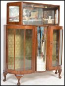 A vintage early 20th Century walnut glazed cocktail cabinet, the cabinet  having a central