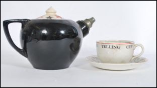 A 1920`s Romany Gypsy fortune telling / tellers tea cup and saucer by JG Meakin together with an