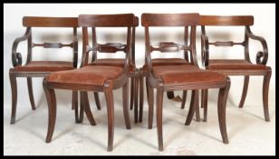 A set of 6 19th century Regency mahogany bar back dining chairs being raised on sabre reeded