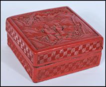 A 19th century Chinese Cinnabar Lacquer box of square form depicting scenes of elder and child