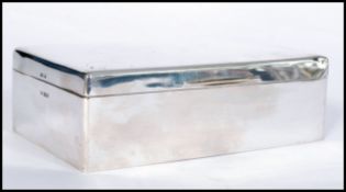 A very large silver hallmarked cigarette / tobacco / cigar humidor box by Walker and Hall. The