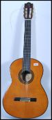 A vintage Yamaha G255 SII acoustic six string guitar having a shaped hollow body with mother of