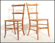 A pair of Victorian aesthetic movement bedroom chairs being raised on faux bamboo legs united by