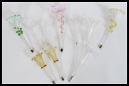 A collection of glass epergne trumpets in the form