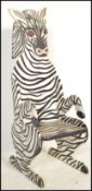 A vintage style child's nursery chair in the form of a zebra having tall picture back.