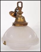 A mid 20th century vintage retro fluted glass ceiling pendant light shade, with brass fittings