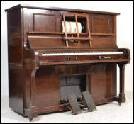 An early 20th century mahogany upright Steck Pianola ' Duo-Art ' being retailed by Duck, Son &
