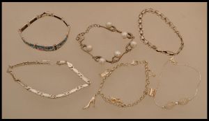 A group of six sterling silver bracelet chains to include curb link, filigree, etc. Total weight
