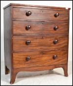 A Victorian 19th century mahogany straight front chest of drawers being raised on kick legs with a