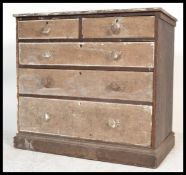 A 19th century Victorian distressed pine 2 over 3 chest of drawers having a sanded finish and the
