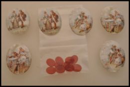 A selection of porcelain oval miniatures with printed images of ladies and gentlemen, and a