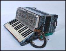 Musical Instruments: A vintage cased 20th Century Accordion, makers mark for La Regina Italia.