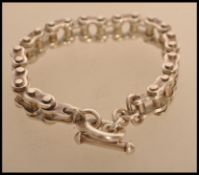 A bike chain bracelet stamped 925 indicating silver. Weight 83.3g