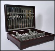 A vintage retro 20th century canteen of cutlery by Robert Welch held within a teak case. 10cm-high