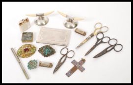 A mixed lot of vintage items to include silver plated cigarette case, ivory date holders,
