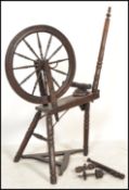A believed 19th century Victoria North County Spinning Wheel having turned legs bobbin style base