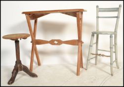 A late 19th Victorian pugin / eclesiastical manner pine Arts and Crafts side table raised on X /