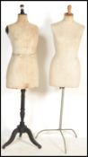 Two vintage early 20th century shop display haberdashery dress makers mannequins raised on wooden