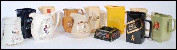 A collection of vintage whiskey advertising point of sale ceramic water jugs to include Benson and