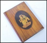 A 19th Century Sorrento three way wooden picture frame with inlaid panels depicting a couple dancing