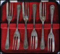 A cased set of six silver hallmarked Emile Viners dessert forks complete in fitted original case.