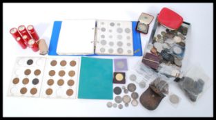 A collection of coins dating from the 19th century to include Victorian crowns and other silver