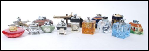 A group of fourteen vintage cigarette lighters to include Ronson, acrylic cubes with inset