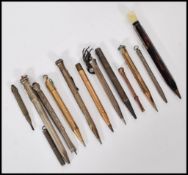 A good collection of propelling pencils dating from the 19th Century to include both gold metal