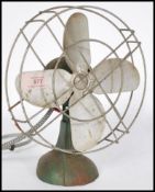 A vintage 20th century retro industrial desk ERCO fun, in green colour with 4 blades aluminium fan