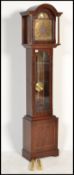 A contemporary antique style mahogany longcase clock with silvered dial being marked Tempus Fugit.